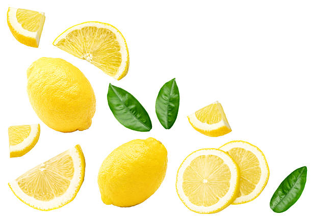 istock lemon with slice and green leaves isolated on white background. clipping path 2207142321