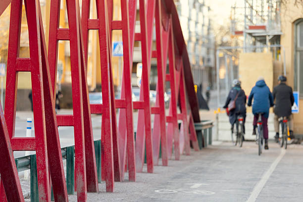 Ottawa, Canada - June 4, 2024: Alexandra Bridge from Ottawa, Ontario to Gatineau city of Quebec with walking people during sunset. Bicycle lane