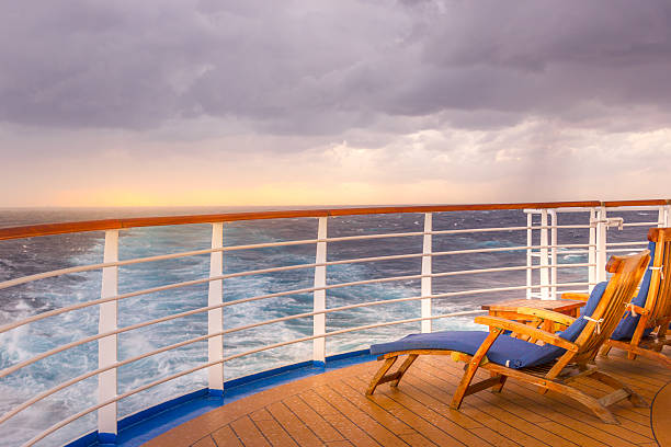 istock .Luxury Cruise Ship Deck with Lounge Seating and Ocean Backdrop 2207146077