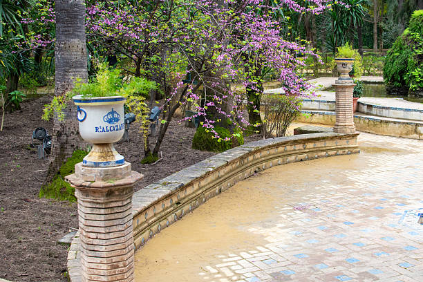 Seville, Spain - Mar 21, 2016: Visitors exploring the beautiful gardens at the Real Alcazar.