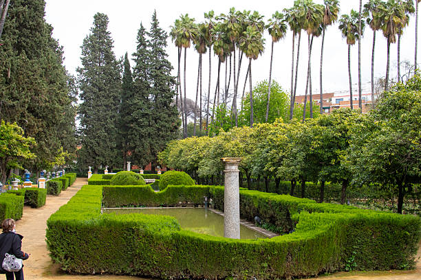 Seville, Spain - Mar 21, 2016: Visitors exploring the beautiful gardens at the Real Alcazar.