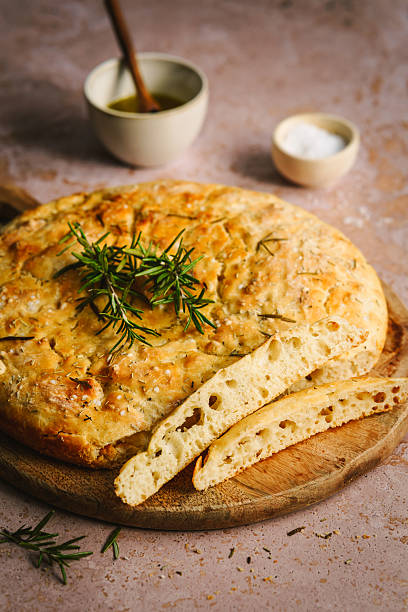istock Baked focaccia bread with rosemary 2207152221
