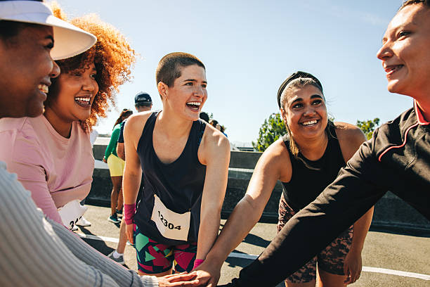 istock Diverse team huddle showing support and encouragement at a marathon 2207153052