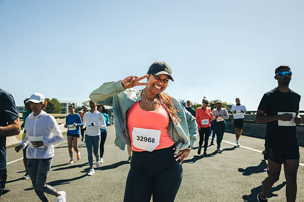 istock Joyful multiracial female athlete running in a race event 2207153468
