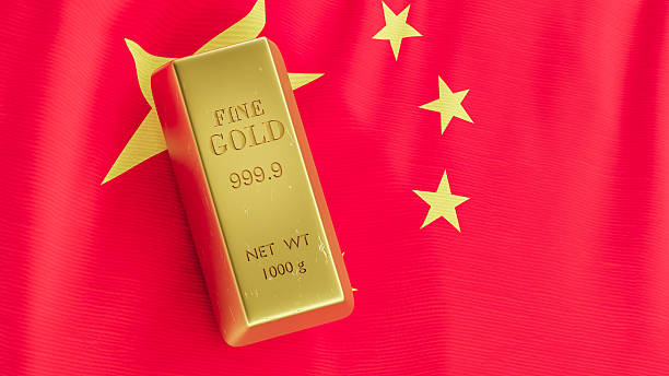 istock PURE GOLD INGOT ON FLAG OF CHINA 2207155142