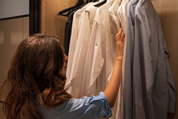 istock Woman Choosing Shirt from Closet – Morning Routine Concept 2207155551