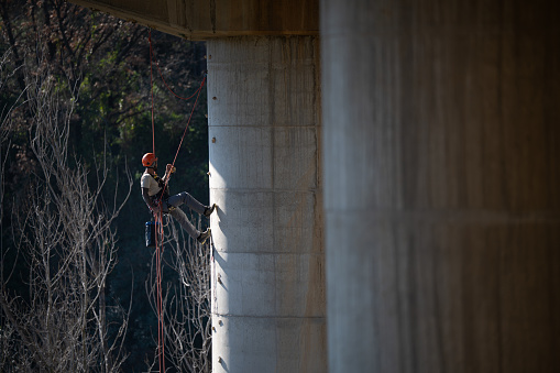 Security Pylon Rope Rope Access Technician Inspecting Bridge Pylon Using Climbing Gear ...