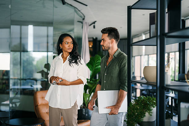 istock Group of young multi-ethnic startup business team collaborating on project in modern office 2207161657