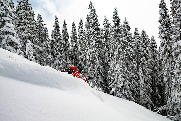 istock Skier descends mountain in fresh powder snow 2207161866