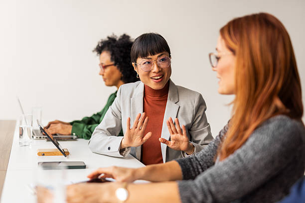 istock Three Colleagues Discussing and Collaborating in a Modern Office Environment 2207162050