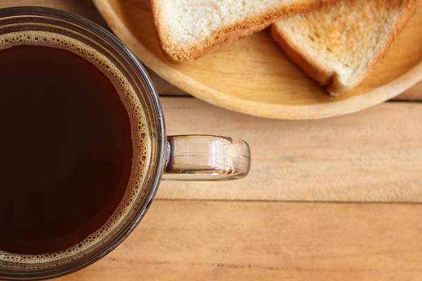 Breakfast of toast bread and black coffee