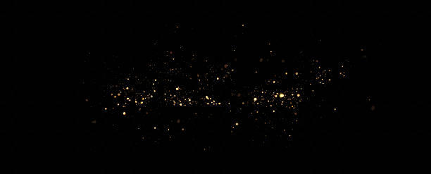 istock Bokeh Lights.Christmas bright gold dust. Festive.Christmas background of shining dust.A magical flash of bright particles 2207162905