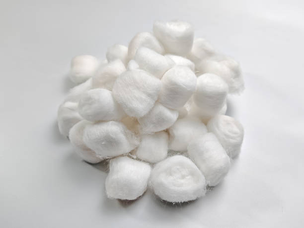 istock Pile of Cotton Balls on White 2207163732