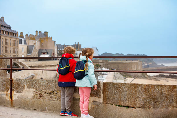istock Curious children admire the view from a coastal lookout point 2207164257