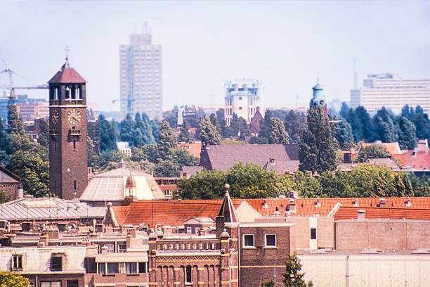 High point with panoramic view over Amsterdam South and the Rivierenbuurt, Zuid-as. 06/26/1988, Amsterdam south, Rivierenbuurt and Zuidas, The Netherlands. Monuments including; Left; St. Agnes Church, right; Vossius Gymnasium, middle; The Appolo House Building