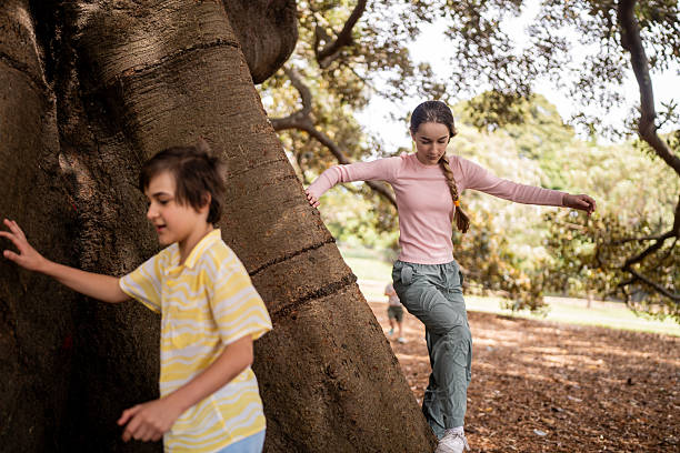 Large group of small kids having fun while playing in nature.