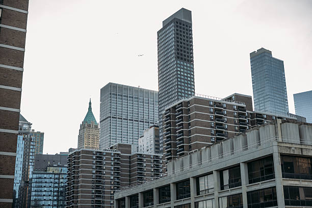 USA, NY - NOVEMBER 5, 2024: Iconic view of Chinatown with bustling streets and Manhattan skyscrapers, seen from the Manhattan Bridge, blending urban vibrancy with cultural charm