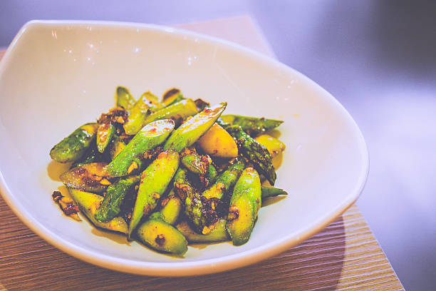 istock Stir Fried Asparagus With XO Sauce served in a white dish 2207171916