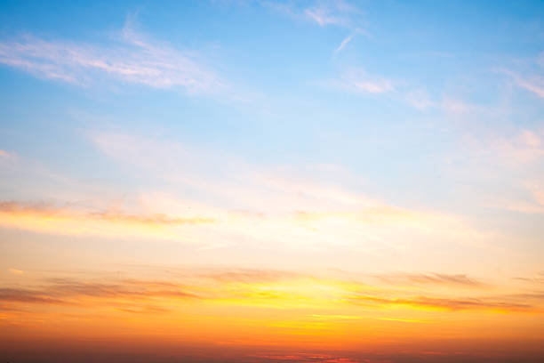 istock Beautiful , luxury soft gradient orange gold clouds and sunlight on the blue sky perfect for the background, take in evening,Twilight, Large size, high definition landscape photo 2207175388