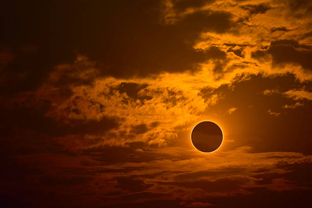 istock eclipse on the gold sunset sky and transparent cloud 2207175450