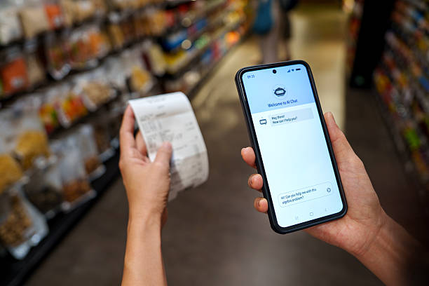 istock AI chatbot interaction with smartphone and receipt in supermarket 2207175897