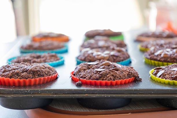 chocolate banana muffins on light background