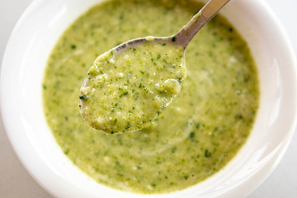 istock vibrant green spring soup made with fresh leek, spinach, and beans, served in a bowl 2207176259