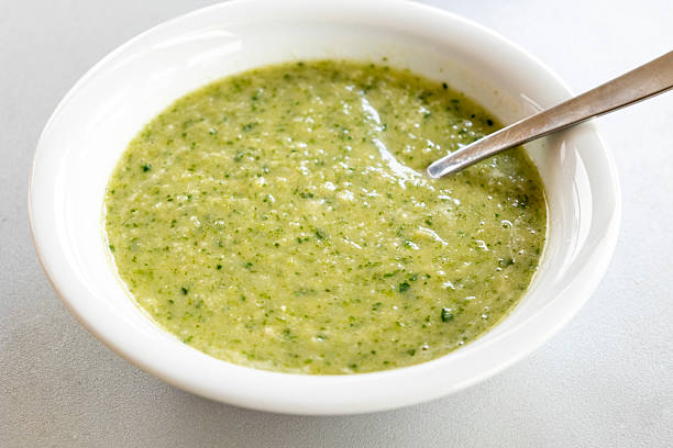 istock vibrant green spring soup made with fresh leek, spinach, and beans, served in a bowl 2207176263