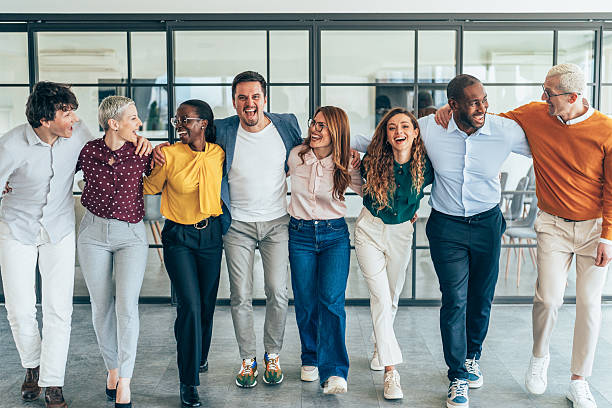 istock Diverse Team of Professionals Standing Together in a Modern Office 2207176537