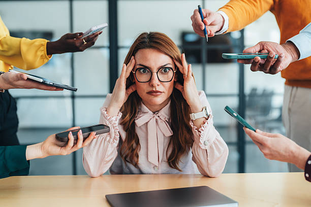 istock Overwhelmed Professional in a Busy Environment 2207176601