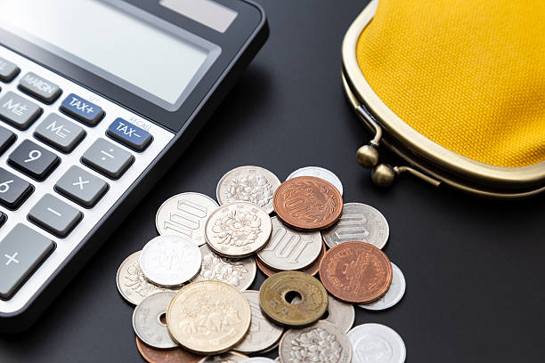 istock A calculator, a wallet and some coins. 2207179057