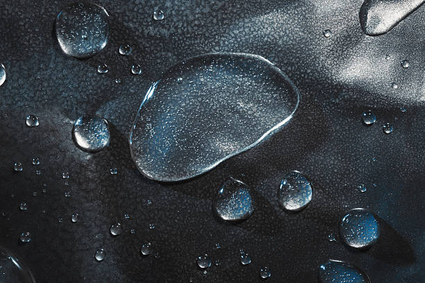 istock Macro of water drops in grunge surface 2207179064