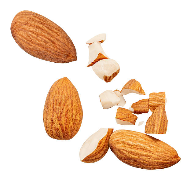istock  Levitating Amond pieces isolated on white background. Crumbs, shavings and Flying Almonds nuts Top view. Flat lay  2207184590
