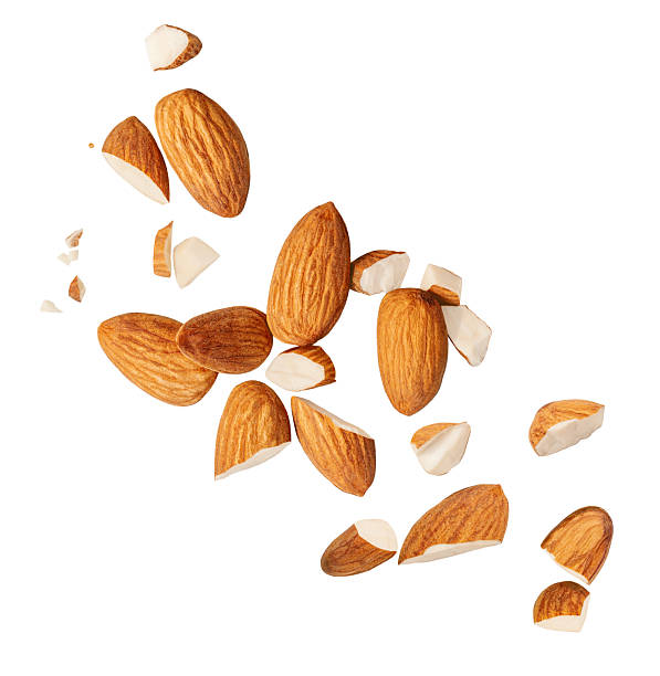 istock Peeled Almonds levitating in air on white background. Isolated Falling crushed almond nuts. Almonds  explosion. Collection. Set  2207184600