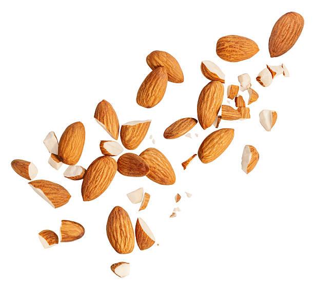 istock Raw Almond nuts  levitating in air on white background. Isolated Falling crushed almonds nuts. Almonds  explosion with crumbs. Collection. Almond design Set  2207184652