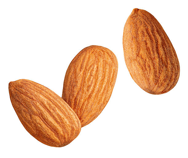 istock Raw Almonds isolated on white background. Whole brown peeled almond nuts  pile. Almonds  Top view. Flat lay. Package design element 2207184680