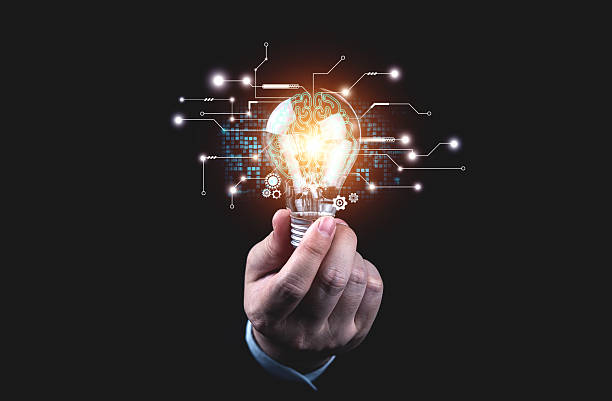 istock Human holding light bulb with brain shape of artificial intelligence. Concept of present new ideas, inspiration, great innovations 2207186125