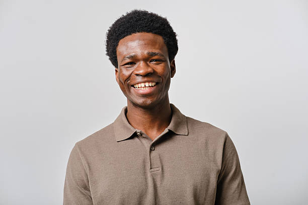 istock Young african man smiling and looking at camera in studio shot 2207188746