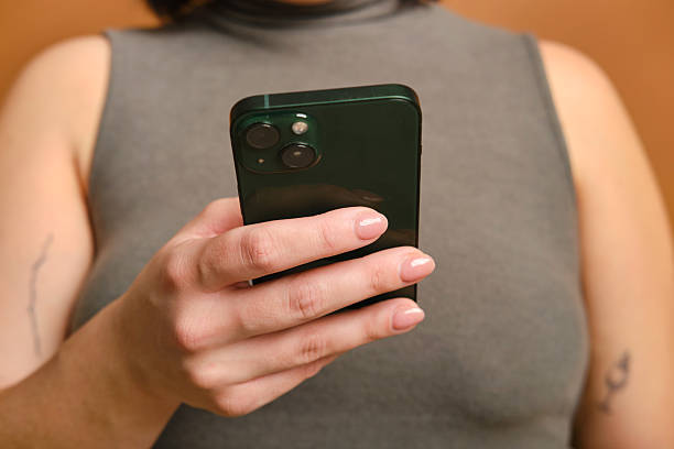 istock Woman using smartphone, browsing internet, reading news. unrecognizable person 2207189055