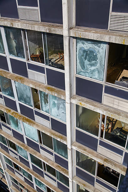 istock Urban Decay and Window Patterns on an Abandoned Hotel Facade 2207189366