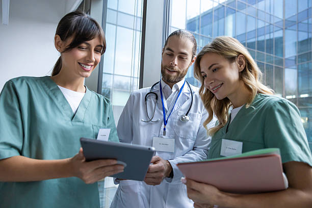 istock Team of young doctors discussing something and looking interested and involved 2207190699