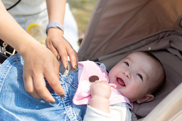 Baby girl smiling in stroller