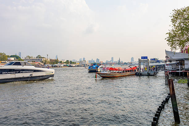 Bangkok, THAILAND - February 20, 2025: View Chao Phraya Express Boat or River Transportation From Wang Lang Pier on Chao Phraya River this is very famous for tourist to travel, Thailand.