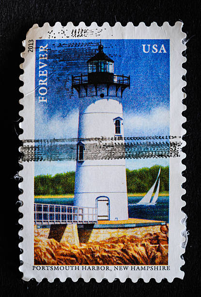A sailboat passes the Portsmouth Harbor , New Hampshire Lighthouse in this 2013 stamp