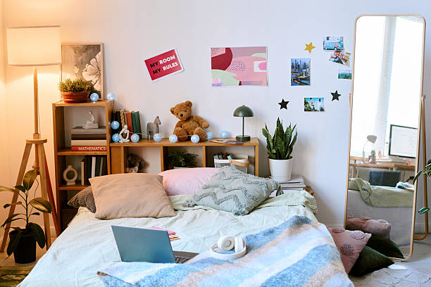 istock Cozy Bedroom Decorated with Personal Touches and Warm Lighting 2207202196
