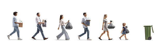 istock People walking in a line with waste for recycling 2207202422
