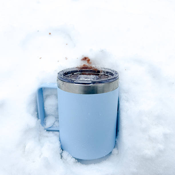 istock Blue Coffee Mug In A Pile Of Snow 2207202503