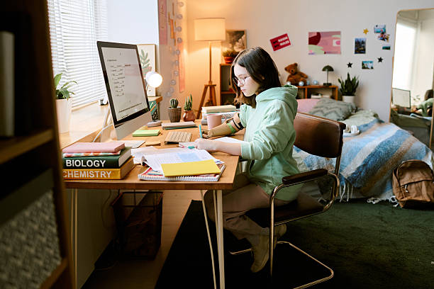 istock Studying in Cozy Bedroom with Green Carpet and Sofa 2207202588
