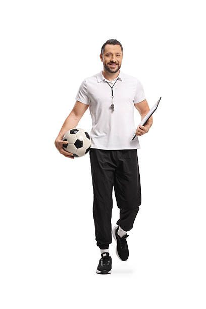 istock Football coach walking towards camera 2207202984