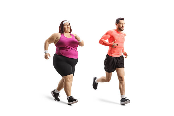 istock Overweight woman running with a personal coach 2207203077